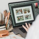 anonymous woman retouching photos using netbook